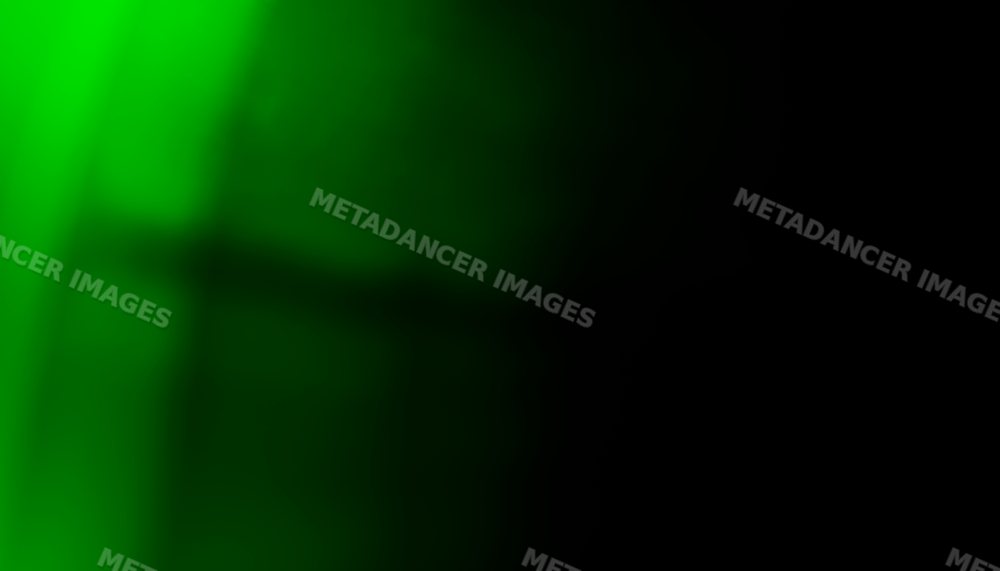 Abstract green glowing light with shadow effects on dark background