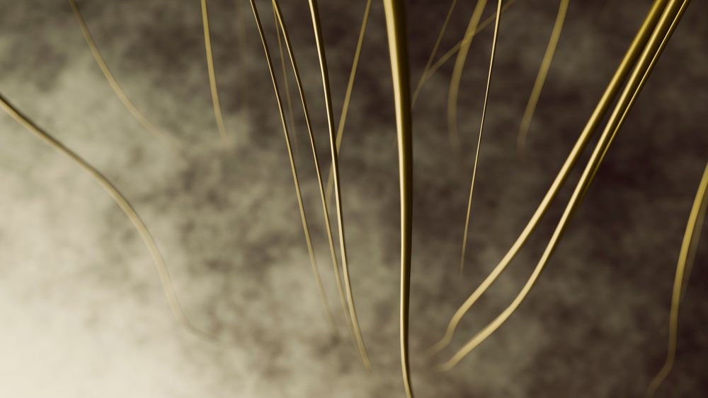 Curved golden wires on a brown textured background create an abstract decorative pattern.