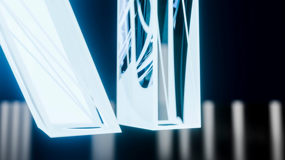 White neon light tubes form geometric shapes glowing against a dark blue background in a modern abstract art installation.