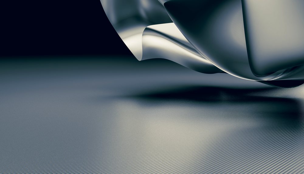 Close-up image of metallic fabric folds with smooth texture and reflective surface.