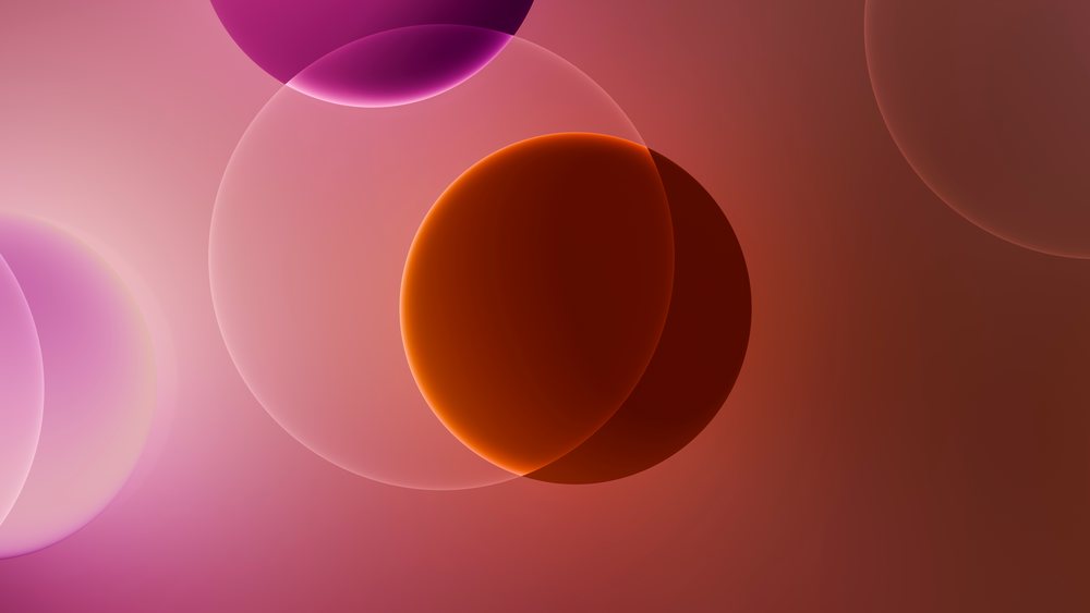 Colorful translucent overlapping bubbles form a soft glowing abstract digital illustration with smooth gradients.