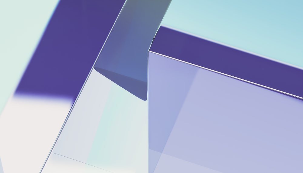 Abstract digital 3D render featuring overlapping translucent blue and purple geometric shapes with smooth edges and reflective surfaces.
