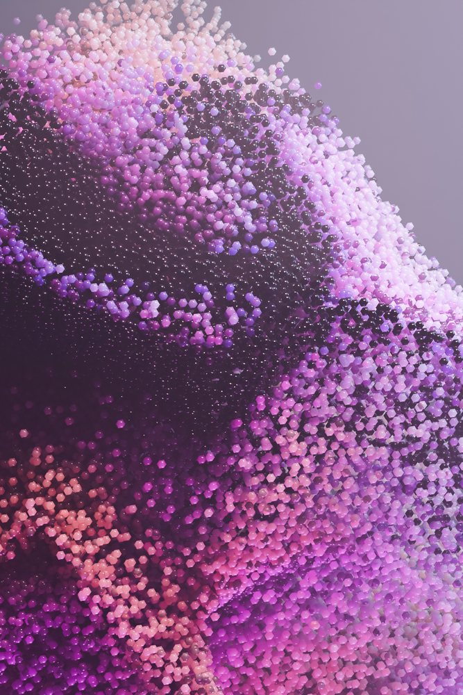 Abstract render of hexagonal particles in pink and purple shades forming a digital art composition.