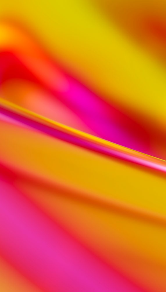 Abstract composition of smooth blurred orange, pink, and yellow gradient lines in soft focus.