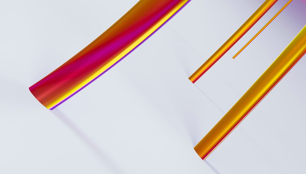 Colorful reflective orange and magenta curved tubes positioned on a white background in an abstract modern composition.
