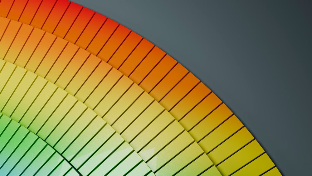 Colorful concentric curved bars forming a smooth 3D gradient pattern on a blue-gray background.