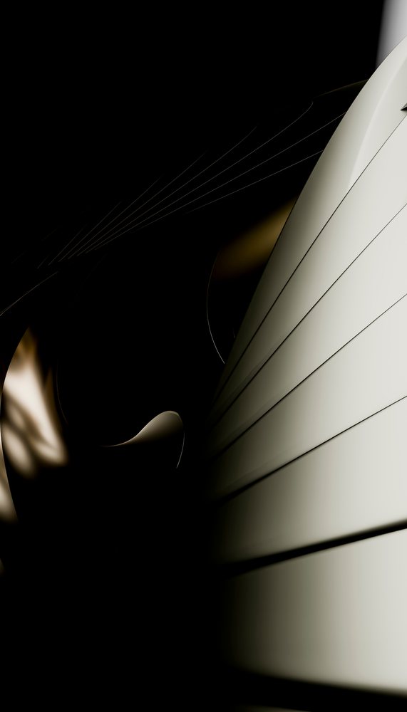 Abstract composition of light and shadows on smooth curved and linear surfaces creating a dark, minimalist pattern.