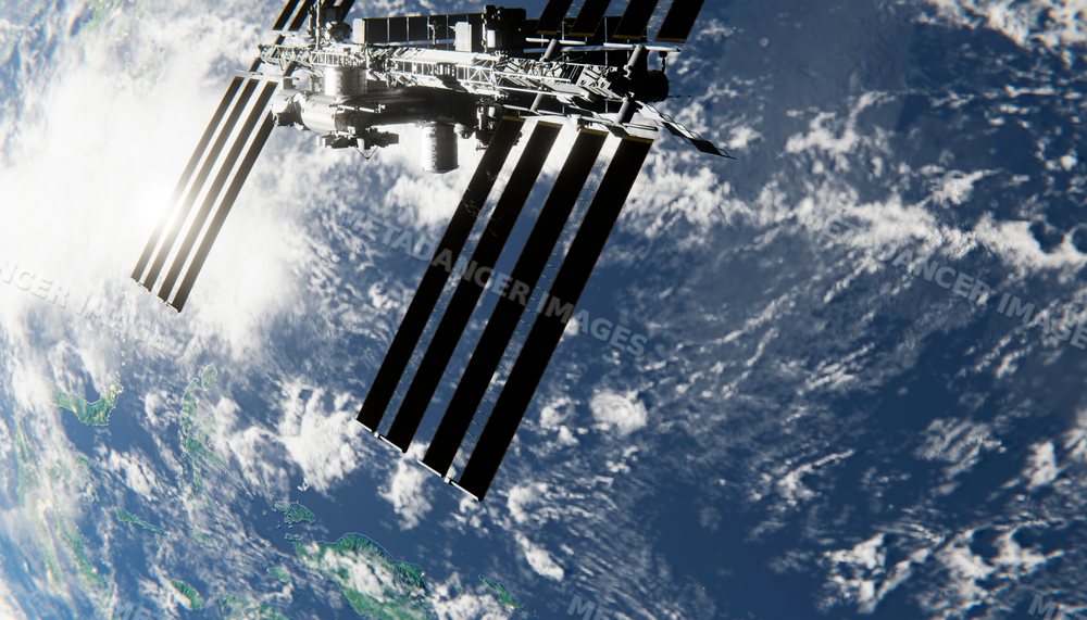 An orbital space station orbits earth with solar panels extended