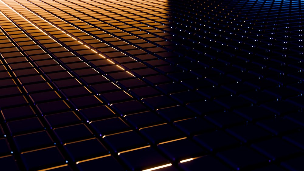 Abstract digital dark tiles arranged in a glowing orange and blue grid pattern with shiny metallic reflections.
