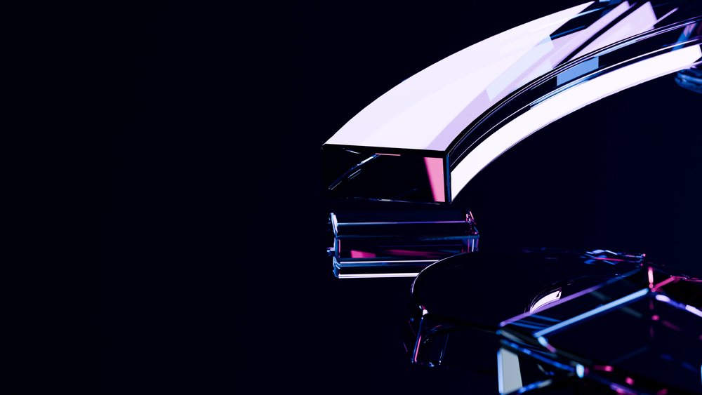 Curved glass shapes with reflective surfaces.
