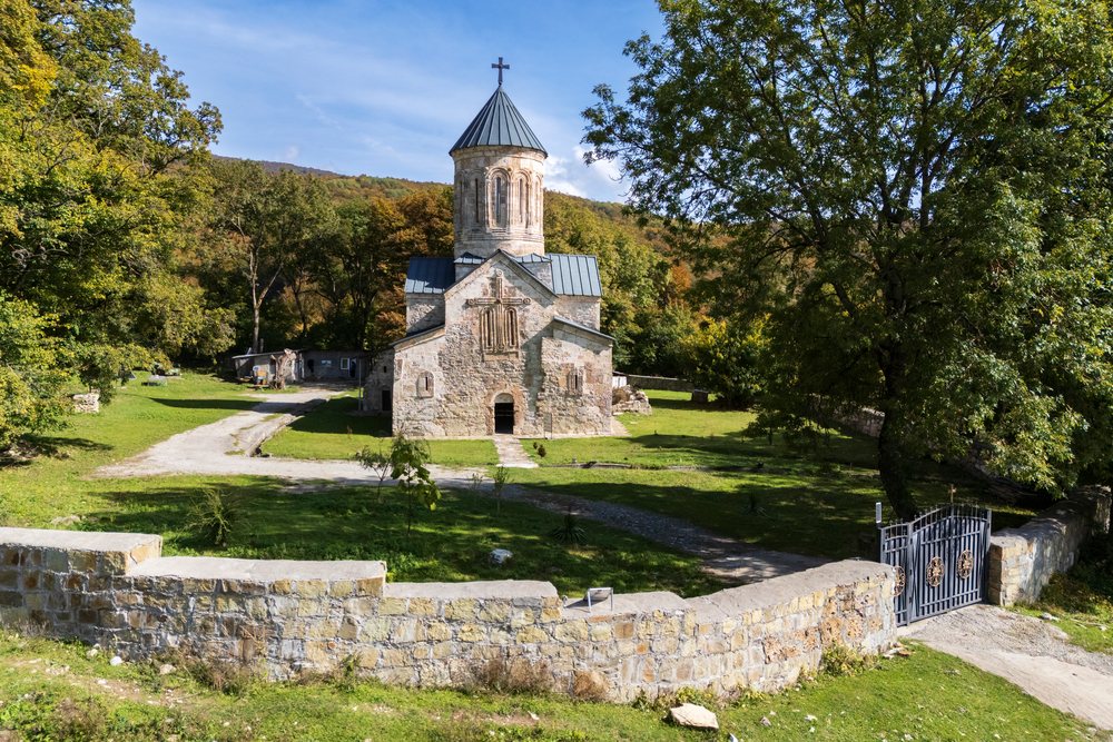 Pudzinari Monastery is a 13th-century medieval Christian stone church with a conical dome topped by a cross, Dusheti Municipality, Georgia.