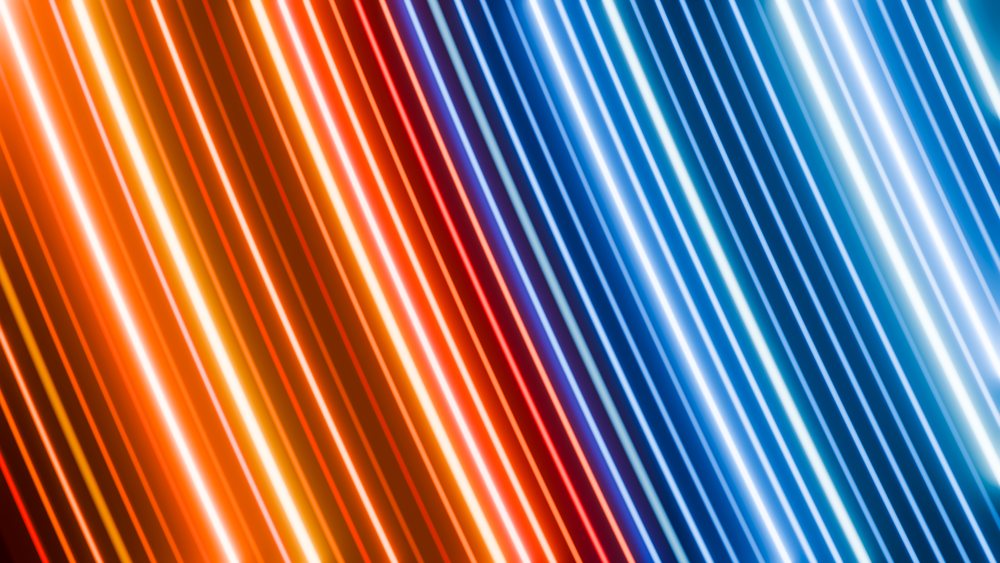 Diagonal neon light streaks in blue and orange create a colorful abstract background.