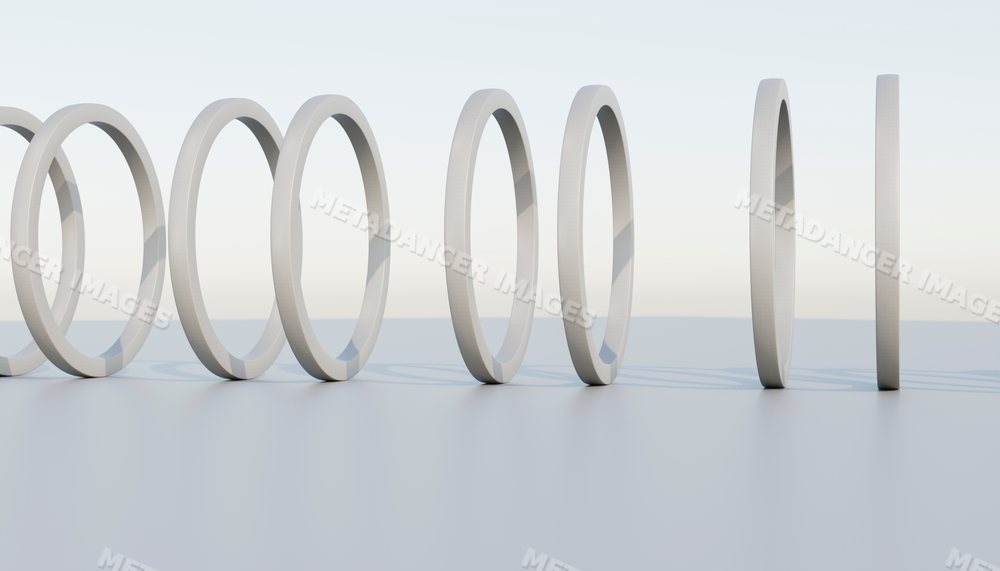 A minimalist sequence of white rings in a clean studio setting