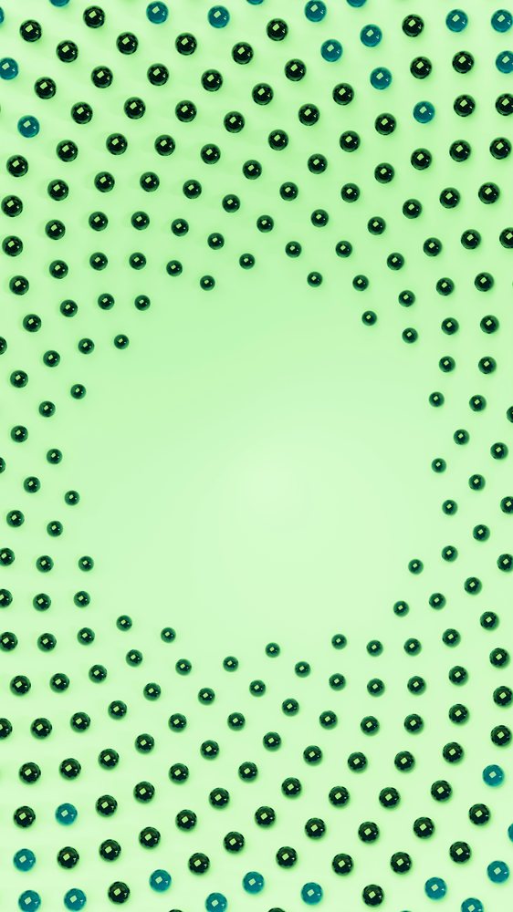 Green and blue pearls arranged in a circular spiral circular pattern on a green surface.