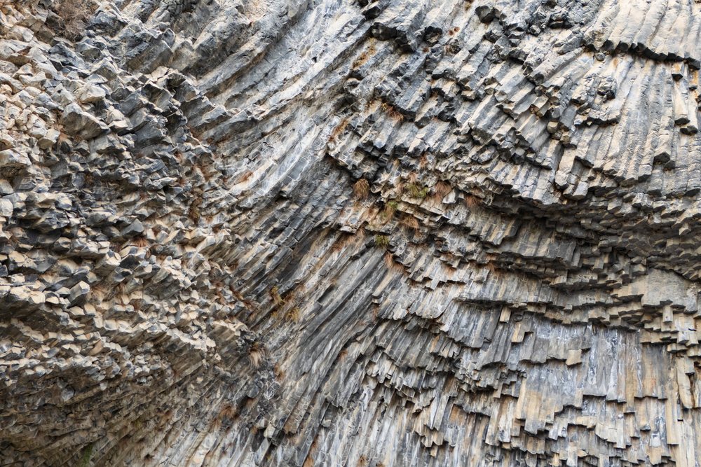 Basalt columns form a striking rock formation on the cliff face below Garni Temple in Garni Gorge, Armenia.