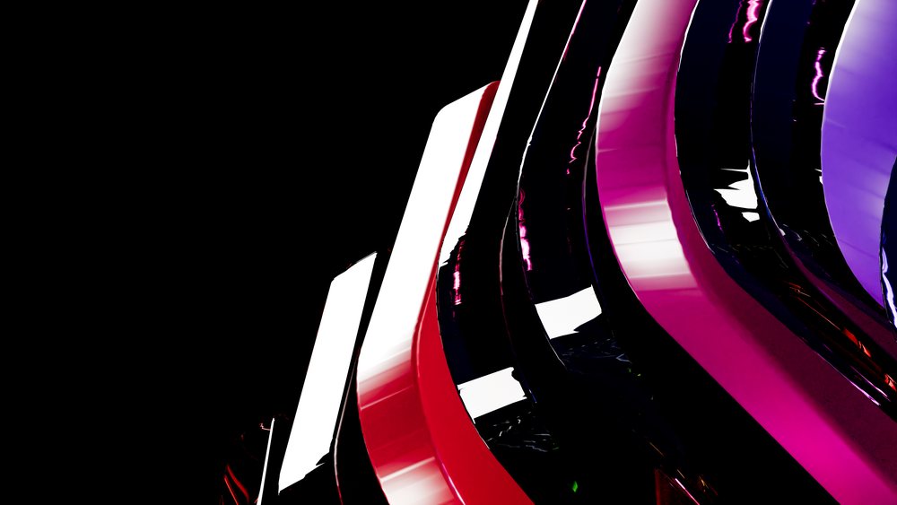 Abstract modern art sculpture with glossy curved red, pink, and purple shapes on a black background.