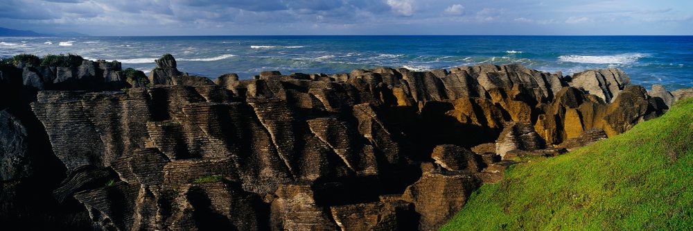 Distinctive layered rock formations of Punakaiki Rocks along the coastal cliff, New Zealand.