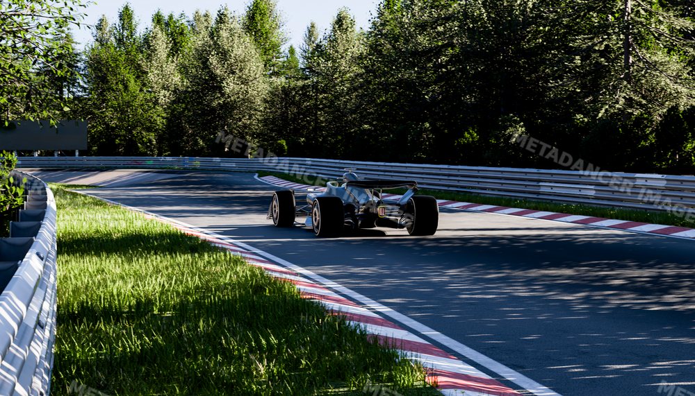 A race car drives on a curved track through a forested race circuit