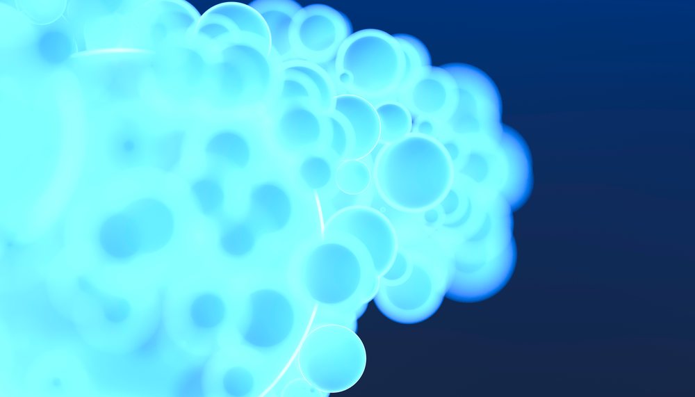 Blue glowing bubbles grouped closely against a dark background creating an abstract light effect.