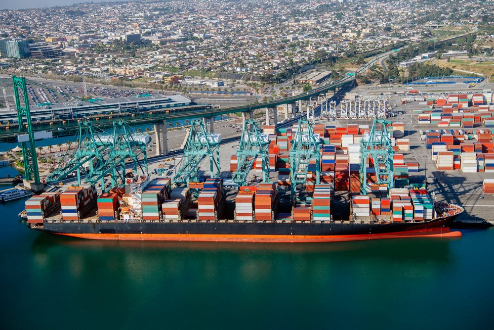 Container ship loaded with cargo containers at a busy container terminal in the, Port of Long Beach, CA, USA.