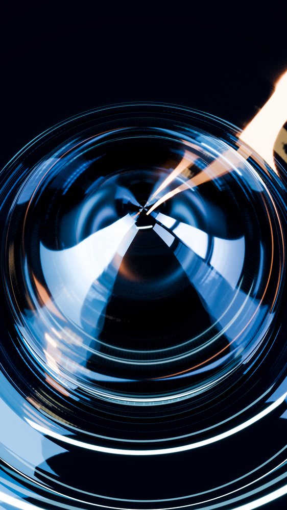 Close-up abstract illustration showing a circular glass surface reflecting a candle flame on a dark background with blue and warm light effects.