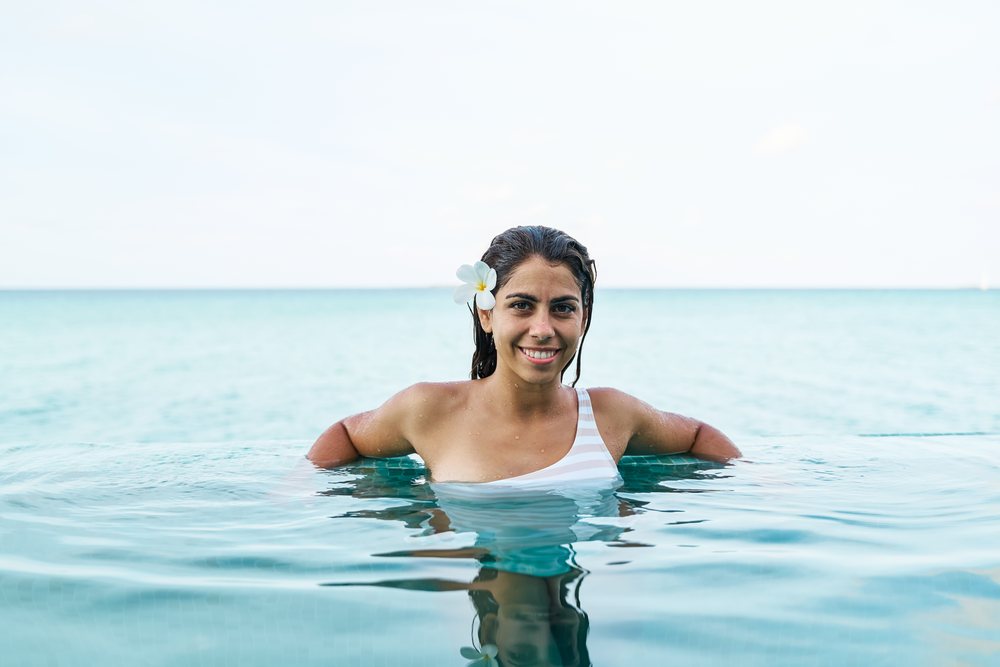 A white woman enjoys relaxing