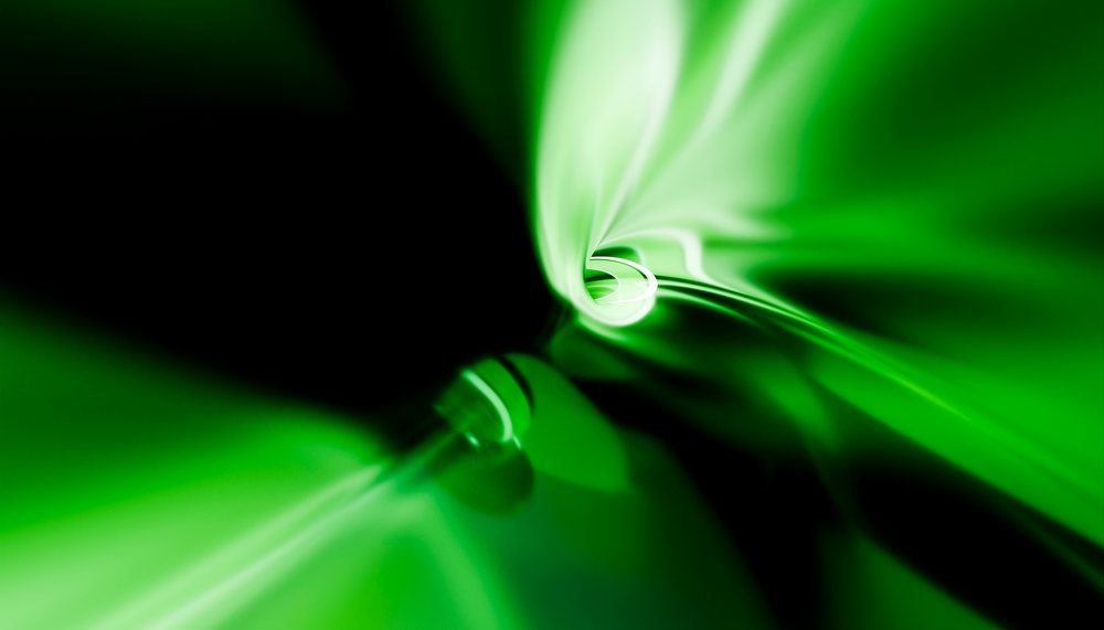 Green abstract swirl with glowing light and fluid shape creating a dynamic vortex motion effect.