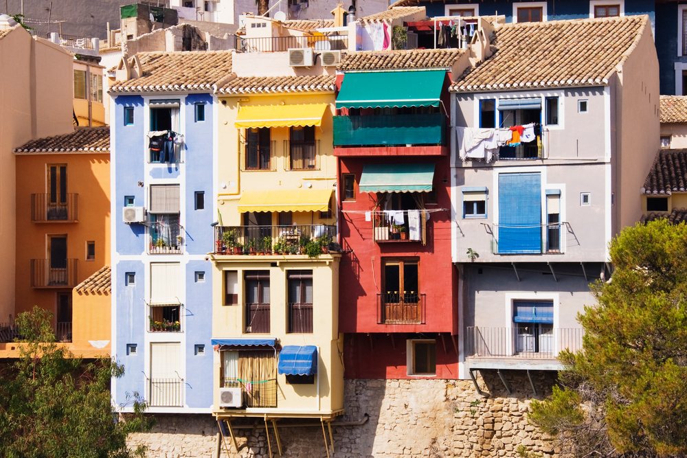 Colorful exterior of residential houses with balconies, Alicante, Spain.
