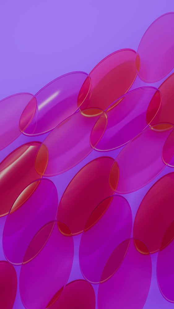 Close-up of overlapping pink and purple transparent softgel capsules on a blue background.