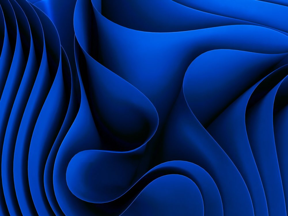 Abstract fluid blue waves create smooth curved shapes with dynamic flow and texture.
