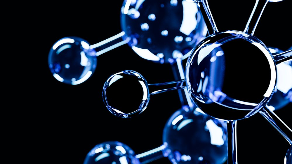 3D illustration of a molecular structure showing blue reflective spherical atoms connected by chemical bonds on a black background.