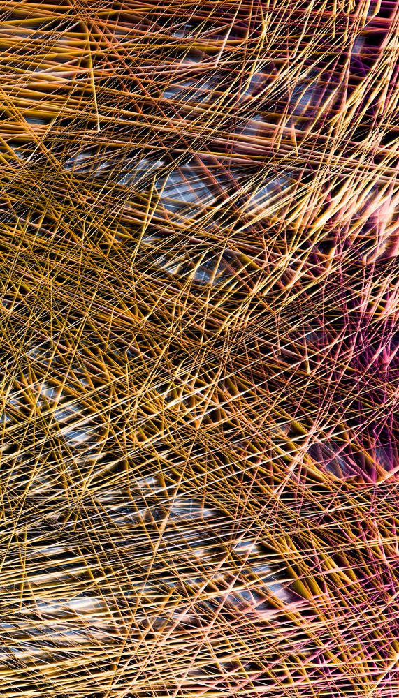 An abstract close-up image of colorful, overlapping thin lines creating a complex geometric pattern.