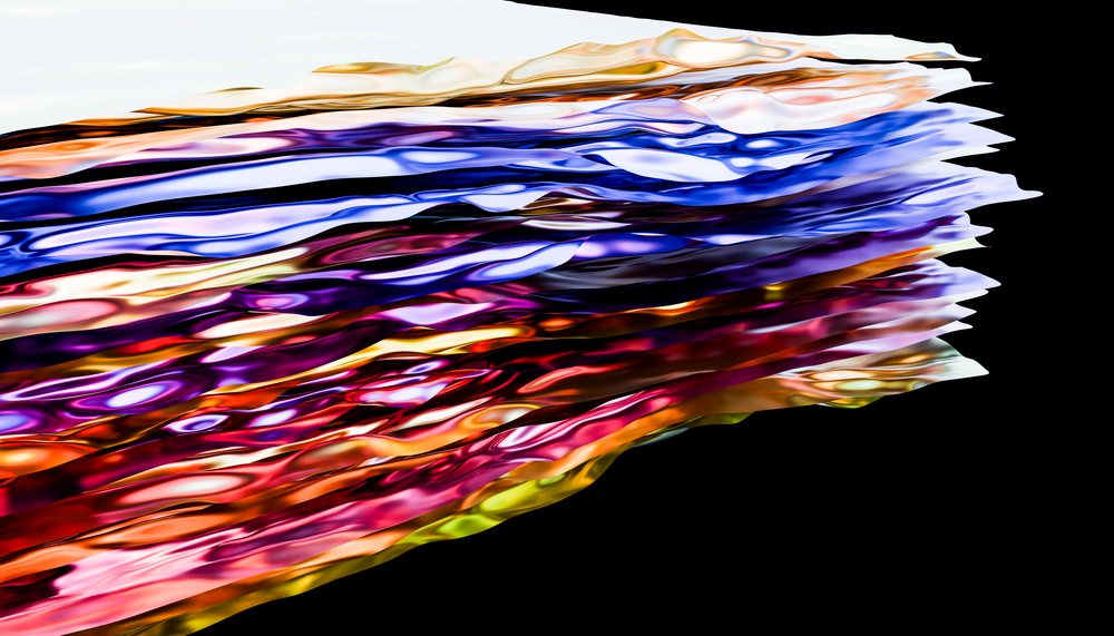 Colorful abstract liquid showing flowing shiny waves of various bright colors against a black background.