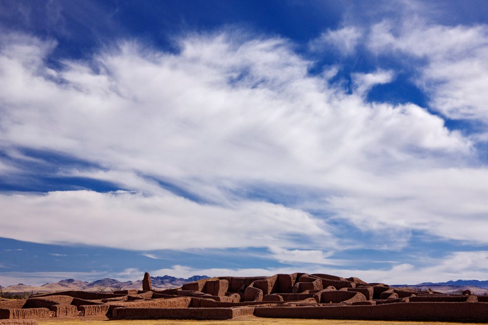 Ruins of masonry walls at the Paquime Archaeological Site, with desert landscape and blue sky, Chihuahua, Mexico.