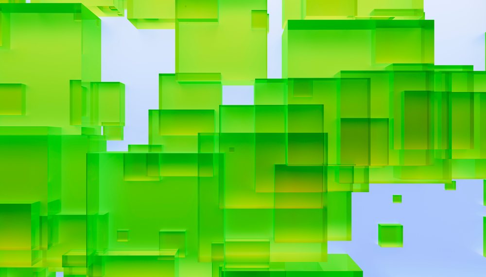 Three-dimensional green transparent cubes floating and overlapping against a blue background in a digital abstract composition.