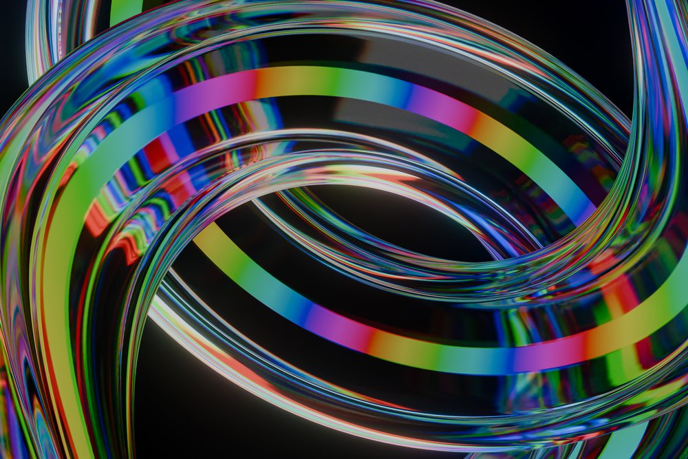 Abstract render of colorful transparent rings and tubes with light reflections on a dark background.