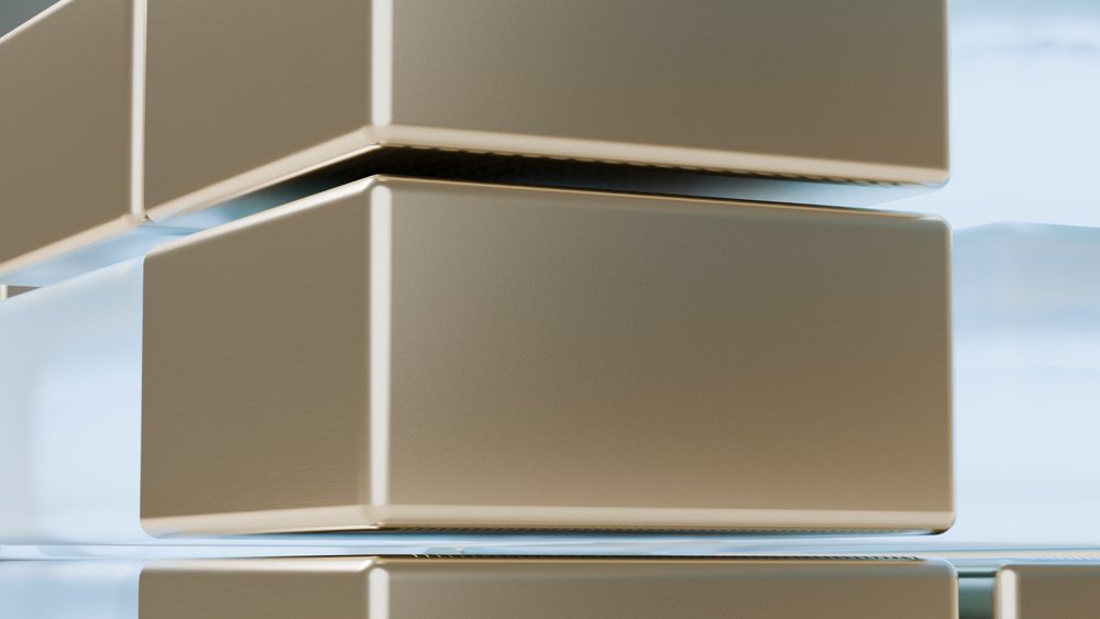 Stacked metallic golden blocks with a reflective shiny surface arranged in a minimalist digital 3D illustration.