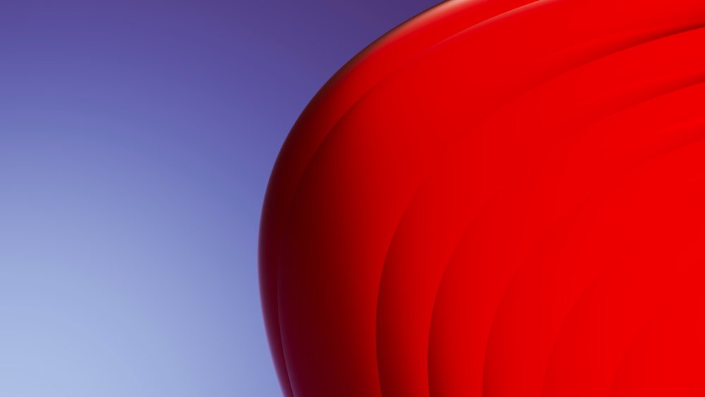 Digital illustration of smooth red circular shapes on a gradient blue background.