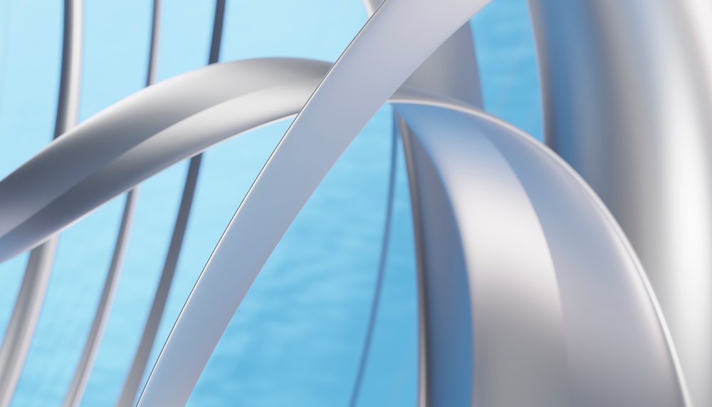 abstract silver loops forming a modern artistic sculpture against a blue background.