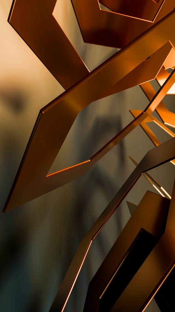 Close-up of reflective brown geometric metal shapes forming a modern abstract artistic pattern.