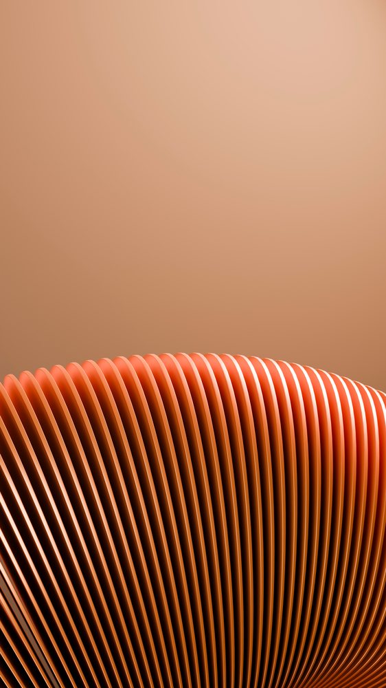 Close-up of an orange abstract design with repeated curved fins and ridges over a gradient background.