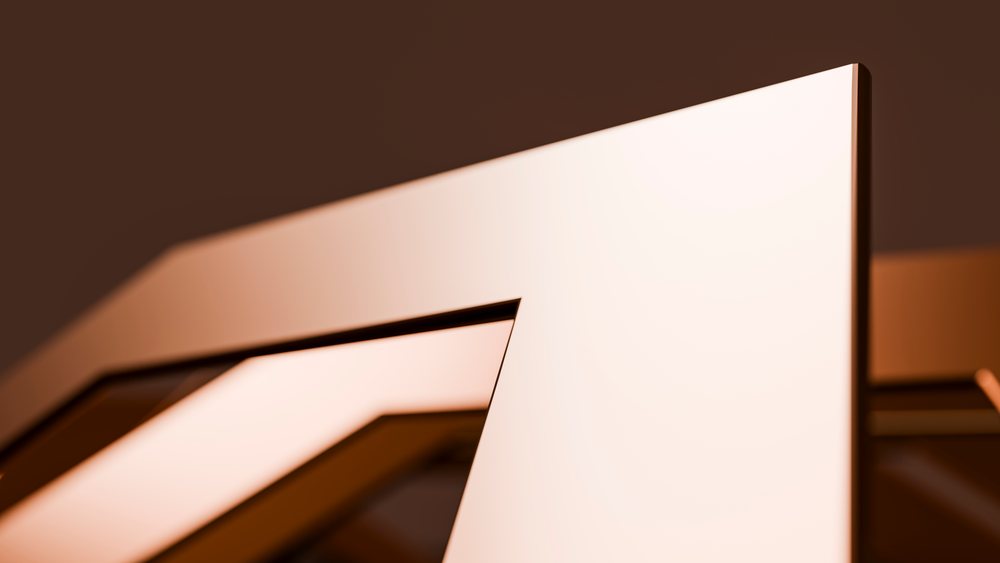 Close-up of an abstract geometric metal sculpture with sharp edges on a brown background.