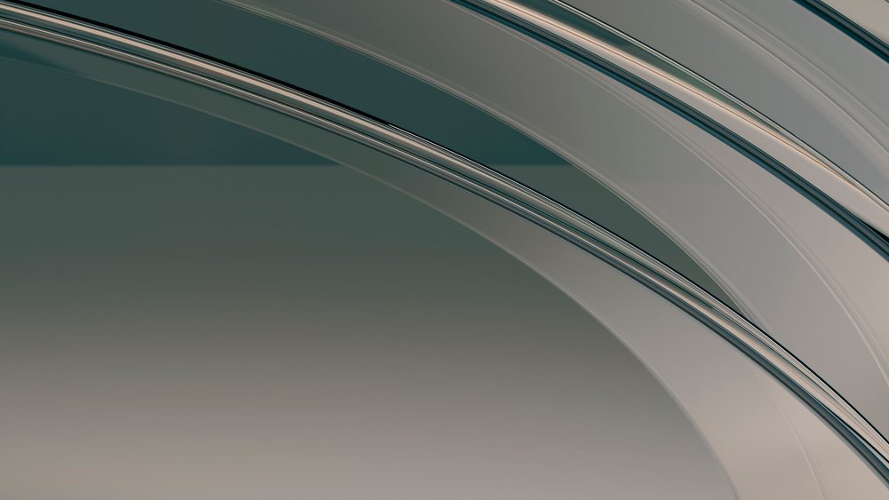 Curved transparent glass arches form a modern abstract architectural element with smooth reflective surfaces.