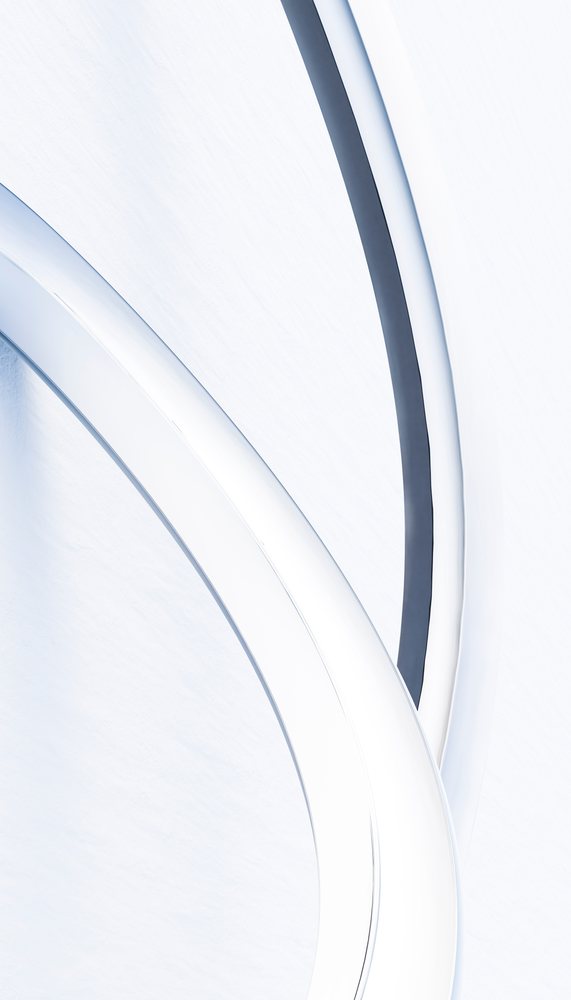 White curved modern sculpture with smooth monochrome surfaces in a contemporary minimalist design.