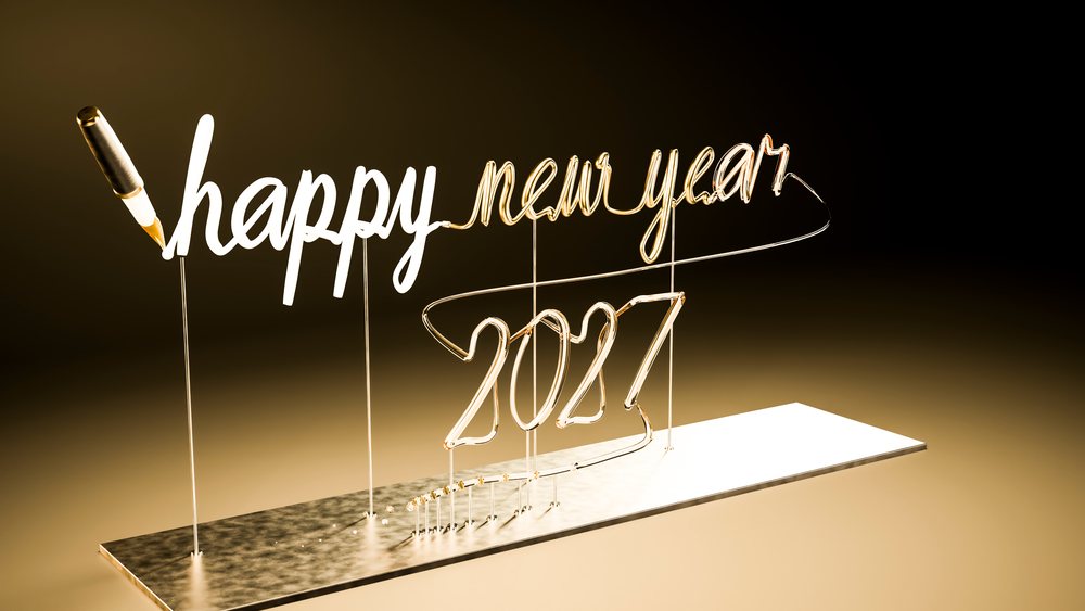 Glowing neon sign displaying 'happy new year 2027' against a with reflective base.