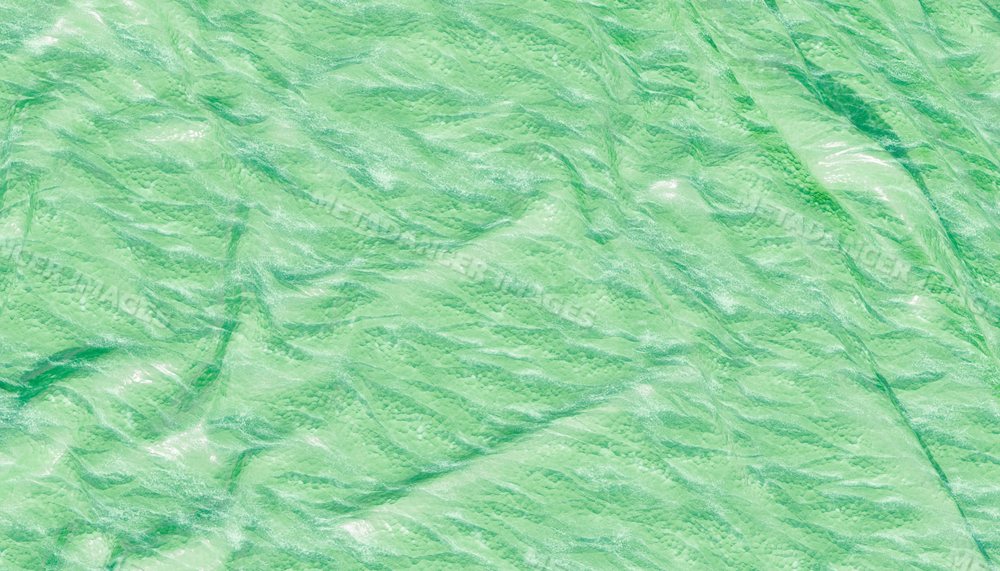 Close-up of wrinkled green textured fabric