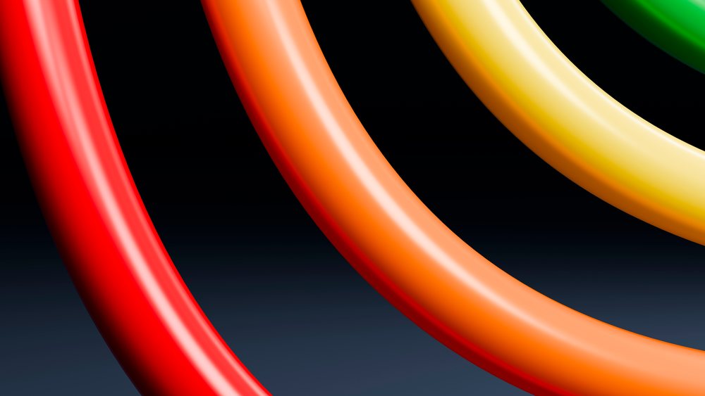 Curved colorful tubes in red, orange, yellow, and green form an abstract design on a gradient dark background.