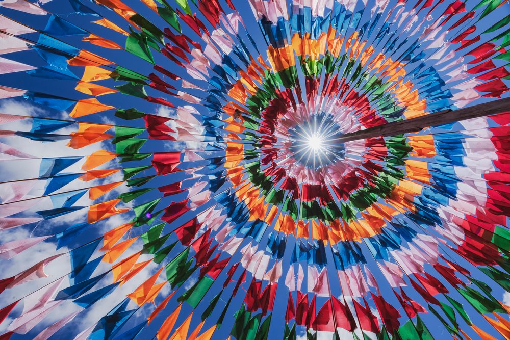 Colorful prayer flags arranged inside a tent structure in Kham Tibet, Shiqu, Sichuan Province, People's Republic of China.