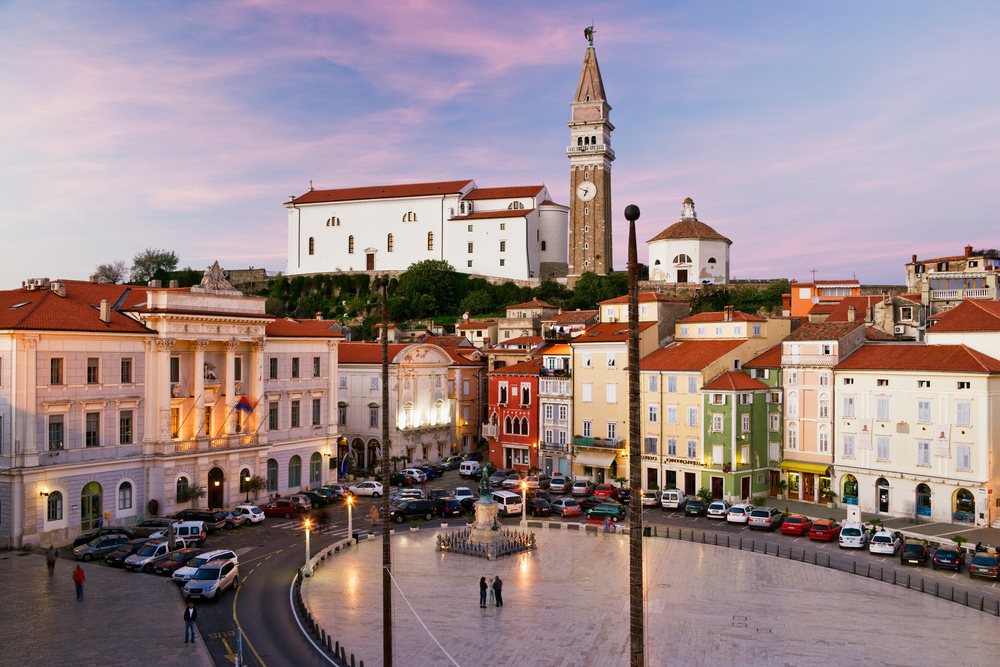 Tartini square with bell tower and historic buildings, Piran, Slovenia.