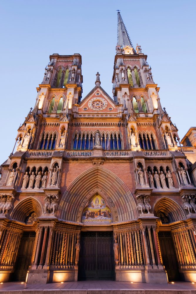 Facade of Iglesia de los Capuchinos church with twin towers and Gothic architecture at sunset, Cordoba, Argentina.
